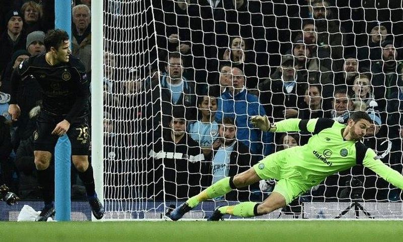 Celtic's goalkeeper Craig Gordon dives to make a save during an UEFA Champions League match in Manchester, in December 2016