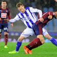Real Sociedad's midfielder David Zurutuza (L) vies with Eibar's midfielder Pedro Leon during the Spanish league football match Real Sociedad vs SD Eibar at the Anoeta stadium in San Sebastian on February 28, 2017