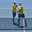 Australia's Sam Groth (R) and Jon Peers celebrate beating Jiri Vesely and Jan Satral of the Czech Republic in their Davis Cup World Group doubles rubber, at Kooyong in Melbourne, on February 4, 2017