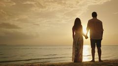 Stock photo of a couple's silhouette on a beach [Credit - Shutterstock]