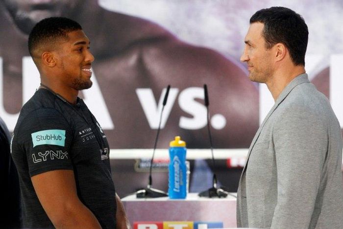 British boxer Anthony Joshua (L) and Wladimir Klitschko of the Ukraine attend a press conference in Cologne, western Germany, on February 16, 2017