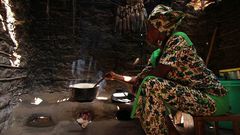 African woman in a hut