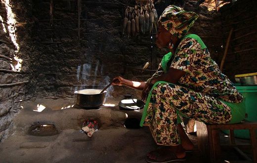 African woman in a hut
