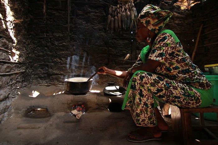 African woman in a hut