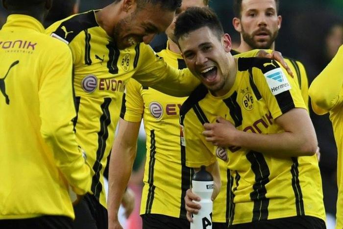 Dortmund's defender Raphael Guerreiro and striker Pierre-Emerick Aubameyang react after a German first division Bundesliga football against Borussia Moenchengladbach on April 22, 2017