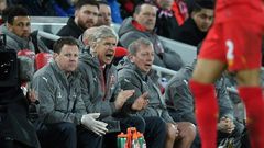 Arsenal's manager Arsene Wenger (C) gestures from the dug-out during their match at Liverpool on March 4, 2017