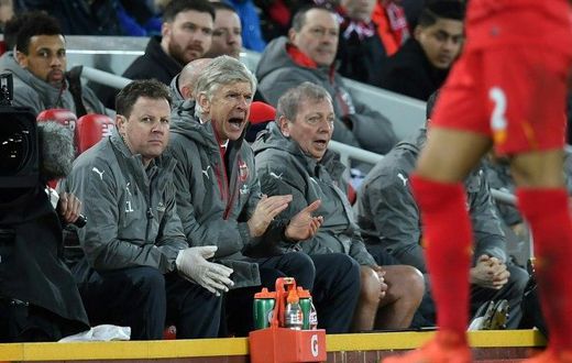 Arsenal's manager Arsene Wenger (C) gestures from the dug-out during their match at Liverpool on March 4, 2017