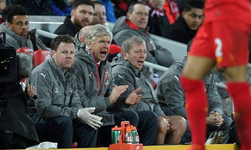 Arsenal's manager Arsene Wenger (C) gestures from the dug-out during their match at Liverpool on March 4, 2017