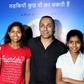 Indian mountaineer Poorna Malavath (L) and actress Aditi Inamdar (R) attend the screening of upcoming Hindi film ‘Poorna’ directed by Rahul Bose (C) in Mumbai on March 27, 2017