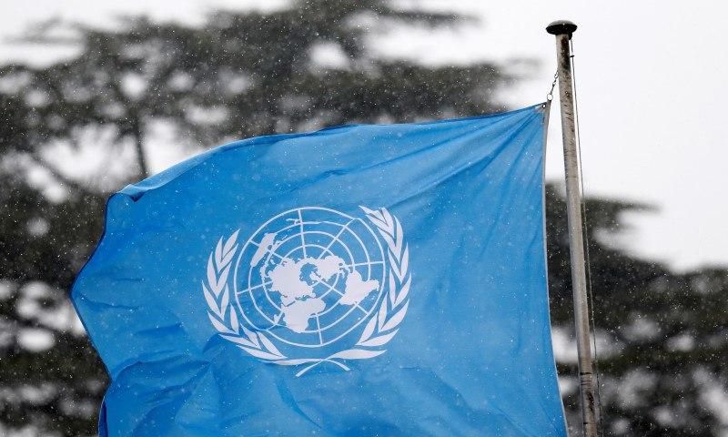 A United Nations flag flies outside the the European headquarters of the United Nations ahead of new round of meetings for the Syria talks in Geneva, Switzerland, March 16, 2016.