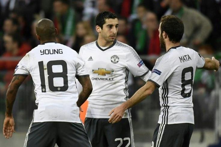 Manchester's United's Henrikh Mkhitaryan (C) celebrates with teammates after scoring a goal during their Europa League match against Saint-Etienne on February 22, 2017