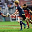 Grenoble's prop Ali Oz (L) passes the ball to lock Thomas Jolmes on March 19, 2016