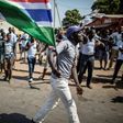 A man waves a Gambian flag while he celebrates the victory of Gambia's opposition candidate Adama Barrow during the Presidential Elections on December 2, 2016, in Serekunda, Banjul