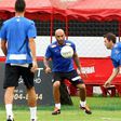 The son of Brazilian football star Pele, former footballer and coach of goalkeepers in Santos FC, Edson Cholbi Nascimento (C), aka Edinho, is seen during a training session at the Rei Pele training center in Santos in 2013