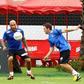 The son of Brazilian football star Pele, former footballer and coach of goalkeepers in Santos FC, Edson Cholbi Nascimento (C), aka Edinho, is seen during a training session at the Rei Pele training center in Santos in 2013