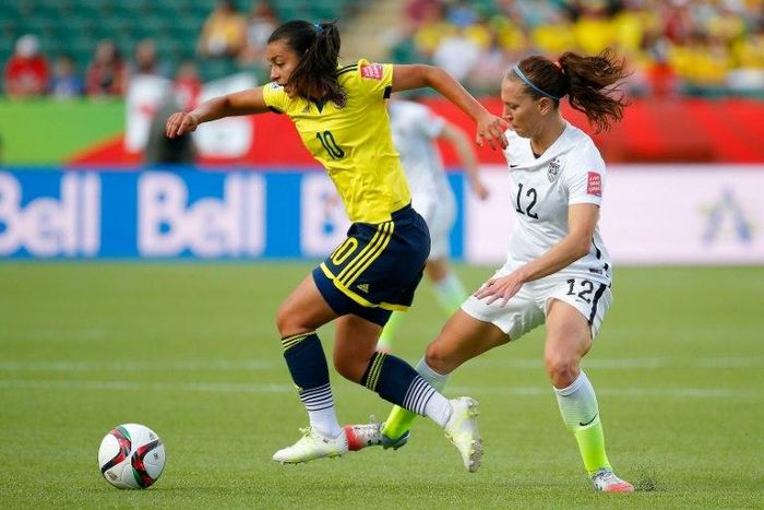 Yoreli Rincon of Colombia controls the ball against Lauren Holiday of the United States in the first half in the FIFA Women's World Cup 2015 Round of 16 match June 22, 2015 in Edmonton, Canada
