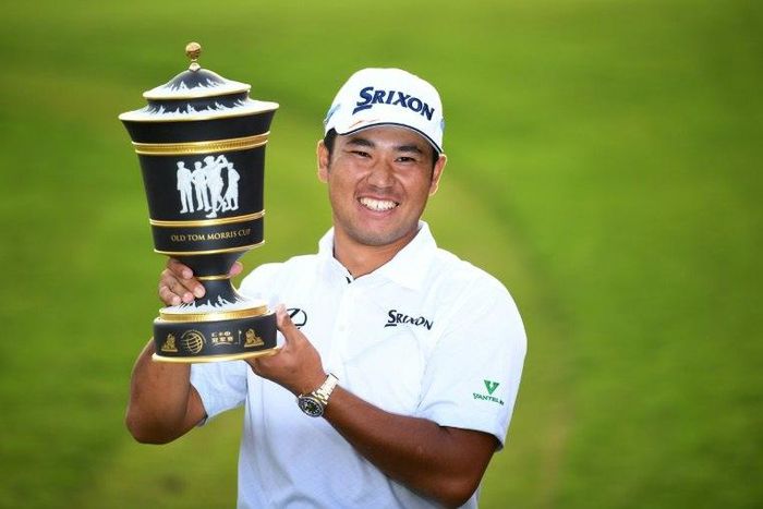 Hideki Matsuyama of Japan poses with the winner's trophy after the final round of the World Golf Championships-HSBC Champions tournament, in Shanghai, on October 30, 2016