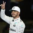 The Mercedes F1 Team's British driver Lewis Hamilton gestures after taking pole in qualifying session as part of the Abu Dhabi Formula One Grand Prix at the Yas Marina circuit on November 26, 2016