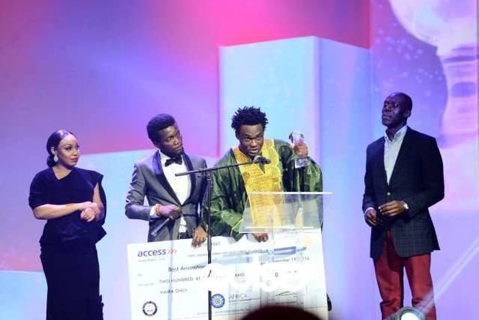 Francis Y. Brown shows off his award