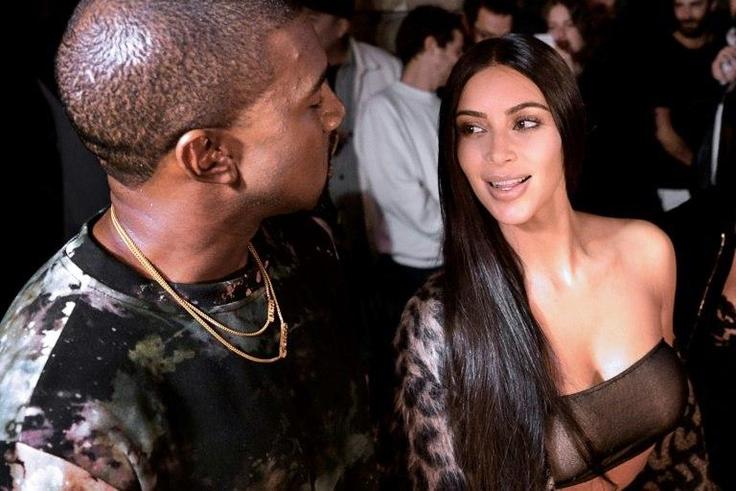 Kanye West and Kim Kardashian (right) pictured at a Paris fashion show on September 29, 2016