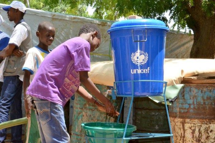 Children wash their hands in a camp for internally displaced people in Diffa, Niger, on August 17, 2016
