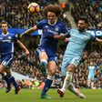 Chelsea's defender David Luiz (C) vies with Manchester City's striker Sergio Aguero (R) during the English Premier League football match between Manchester City and Chelsea at the Etihad Stadium in Manchester, north west England, on December 3, 2016