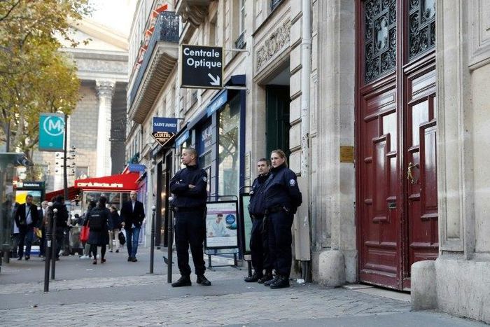 Police stand guard at the entrance of the luxury residence where US reality television star Kim Kardashian was robbed at gunpoint by assailants disguised as police, in Paris, in October 2016