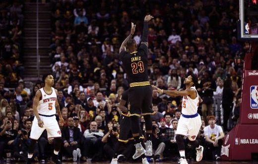LeBron James #23 of the Cleveland Cavaliers shoots in the first quarter against Derrick Rose #25 of the New York Knicks on October 25, 2016 in Ohio