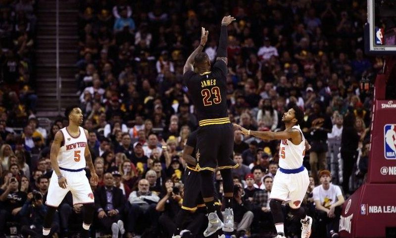 LeBron James #23 of the Cleveland Cavaliers shoots in the first quarter against Derrick Rose #25 of the New York Knicks on October 25, 2016 in Ohio