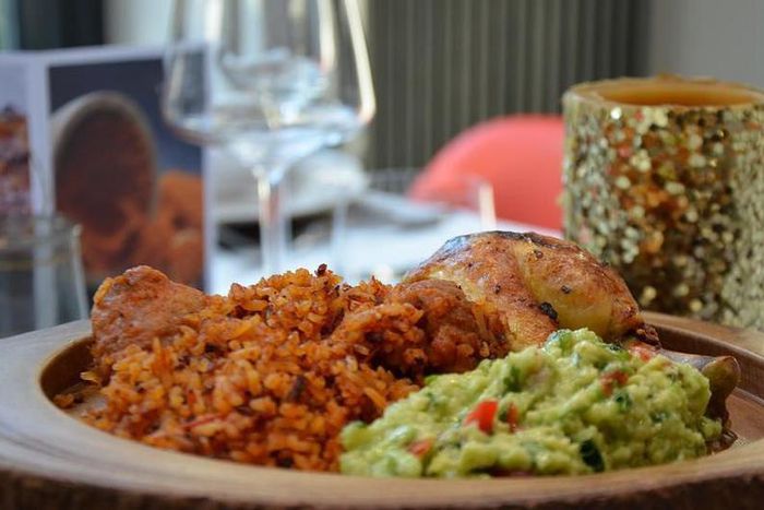 Jollof rice with Guacamole and roasted Chicken ( Ndudu by fafa)