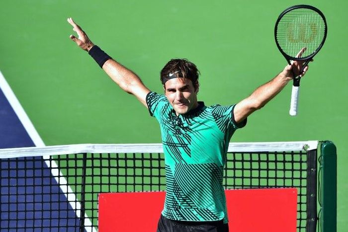 Roger Federer celebrates victory against compatriot Stan Wawrinka in the final of the Indian Wells Masters on March 19, 2017