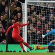 Roberto Firmino (L) scores against Arsenal as Liverpool beat Arsenal 3-1, form they need to beat Burnley