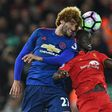 Manchester United's Marouane Fellaini (left) battles with Liverpool's Sadio Mane at Anfield on October 17, 2016