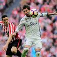 Athletic Bilbao's Aritz Aduriz vies with Real Madrid's Sergio Ramos (right) during their Spanish league match at the San Mames stadium in Bilbao on March 18, 2017