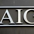 AIG reported a loss of $3.0 billion in the fourth quarter following a hefty charge to build reserves for future losses