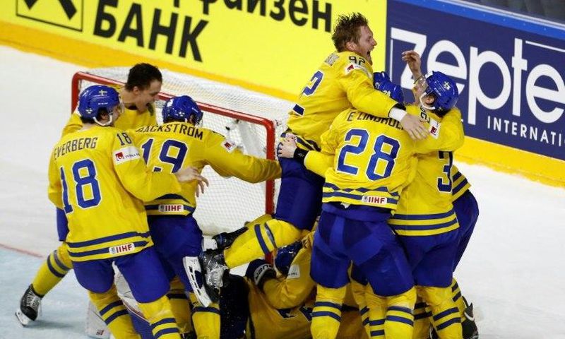 Sweden's players celebrate after winning the penalty shoot-out of the IIHF Men's World Championship Ice Hockey final match on May 21, 2017