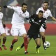 Lyon's midfielder Corentin Tolisso (C) vies with Sevilla's midfielder Vicente Iborra (2ndL) and midfielder Pablo Sarabia (R) during the UEFA Champions League Group match between Olympique Lyonnais and FC Sevilla on December 7, 2016