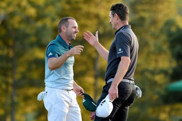 Justin Rose (R) congratulates Sergio Garcia after Garcia wins the 2017 Masters Tournament at Augusta National Golf Club