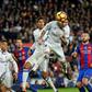 Real Madrid's defender Sergio Ramos (C) heads a ball to score the equalizer past Real Madrid's Raphael Varane (3rdL) and Barcelona's defender Javier Mascherano (R) during the Spanish league football match on December 3, 2016