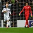 Tottenham Hotspur's midfielder Christian Eriksen (C) collects the ball after scoring the opening goal during the UEFA Europa League Round of 32 second-leg football match between Tottenham Hotspur and KAA Gent on February 23, 2017