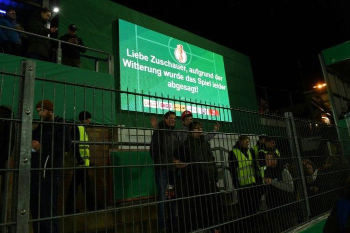 Infromation board reads, "Dear fans, due to the adverse weather conditions, the match has being cancelled" in Sportpark am Lotter Kreuz in Lotte, western Germany on February 28, 2017