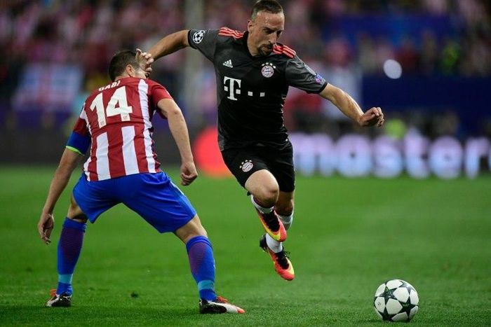 Bayern Munich forward Franck Ribery skips past Atletico Madrid midfielder Gabi during the Champions League group match at the Vicente Calderon Stadium in Madrid on September 28, 2016