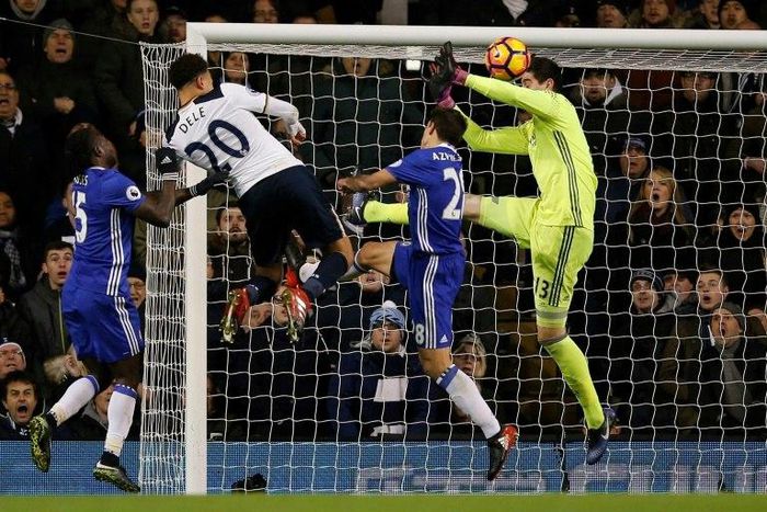 Tottenham Hotspur's midfielder Dele Alli (2nd L) jumps to score his and Totenham's second goal with this header during the English Premier League football match between Tottenham Hotspur and Chelsea at White Hart Lane in London, on January 4, 2017