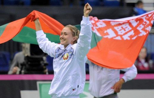 Aliaksandra Sasnovich celebrates putting Belarus into the final of the Fed Cup after her three-set win against Switzerland's Viktorija Golubic on April 23, 2017