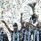Juventus' players celebrate with the trophy after winning the "Scudetto" at the Juventus Stadium in Turin on May 21, 2017