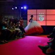A model wears a creation by designer Micaela Oliveira during a presentation by Portuguese football club Benfica of 24 wedding dresses, 12 evening dresses and four dresses for girls at the Stadium of Light in Lisbon