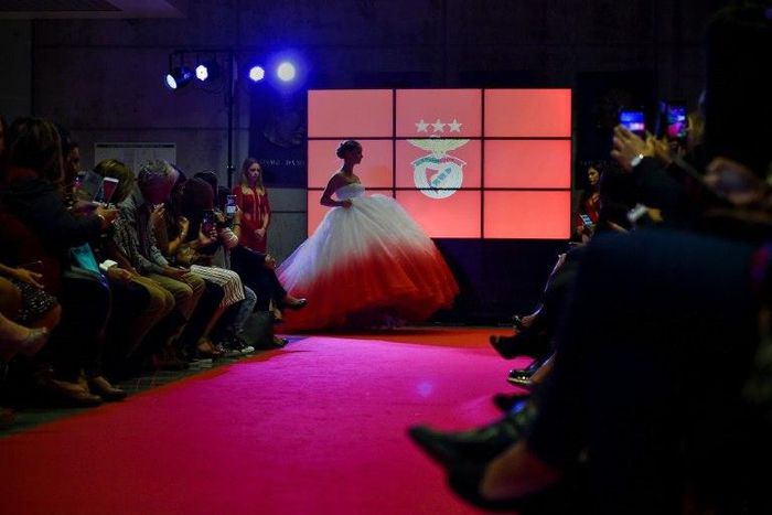 A model wears a creation by designer Micaela Oliveira during a presentation by Portuguese football club Benfica of 24 wedding dresses, 12 evening dresses and four dresses for girls at the Stadium of Light in Lisbon