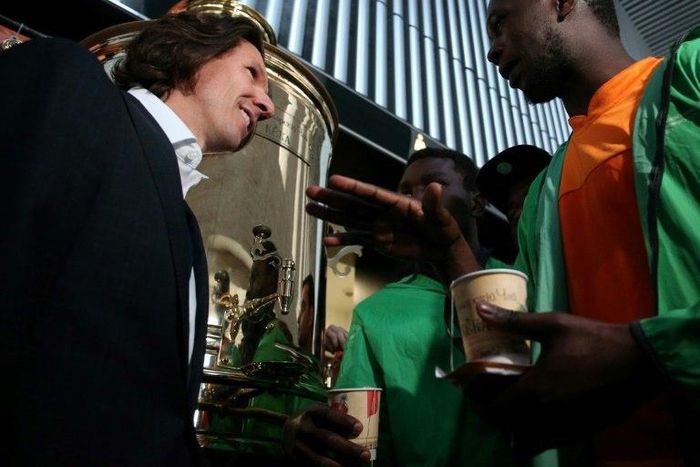 Russian football anti-racism watchdog Alexei Smertin (L) talks to an Ivorian supporter during an anti-racism event ahead of a friendly Russia vs Ivory Coast, in Krasnodar, on March 24, 2017