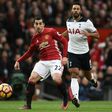 Manchester United midfielder Henrikh Mkhitaryan (L) in action against Tottenham Hotspur at Old Trafford on December 11, 2016