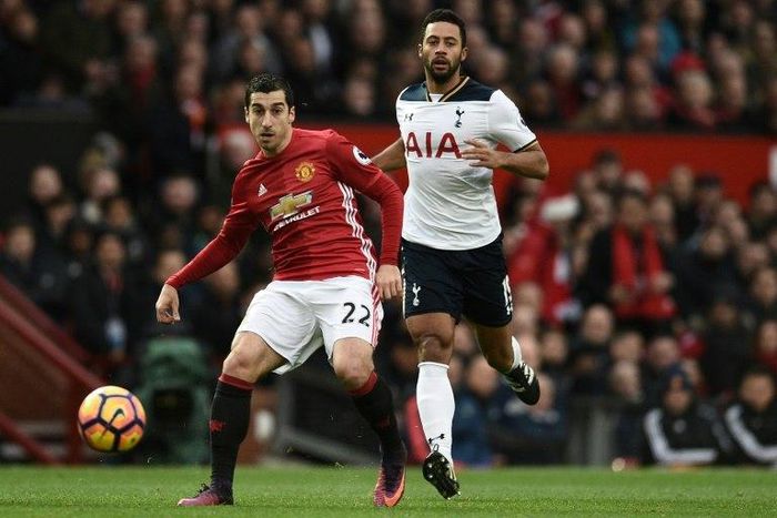 Manchester United midfielder Henrikh Mkhitaryan (L) in action against Tottenham Hotspur at Old Trafford on December 11, 2016
